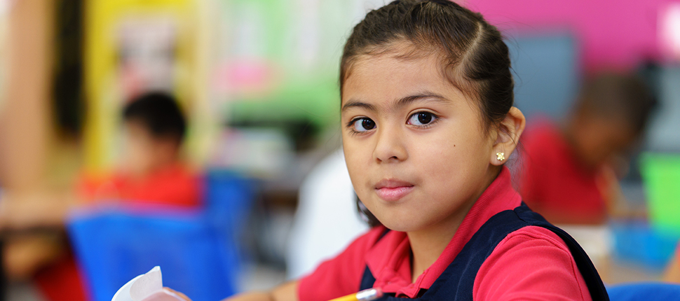 Elementary school girl looking at camera