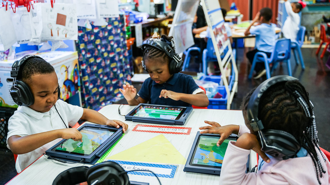 Pre-K students working on smart tablet