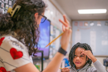 Classroom teacher guiding students