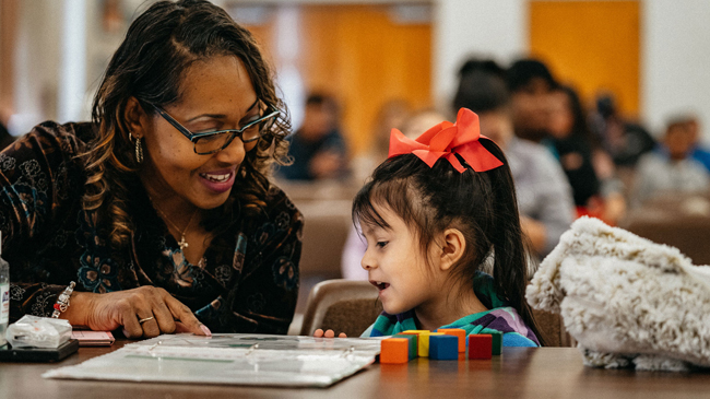 Pre-k team member testing a child