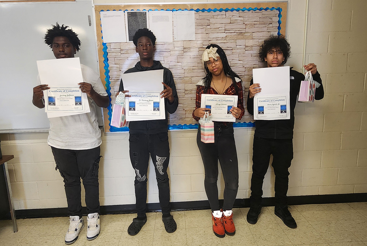 Staff member supporting a student